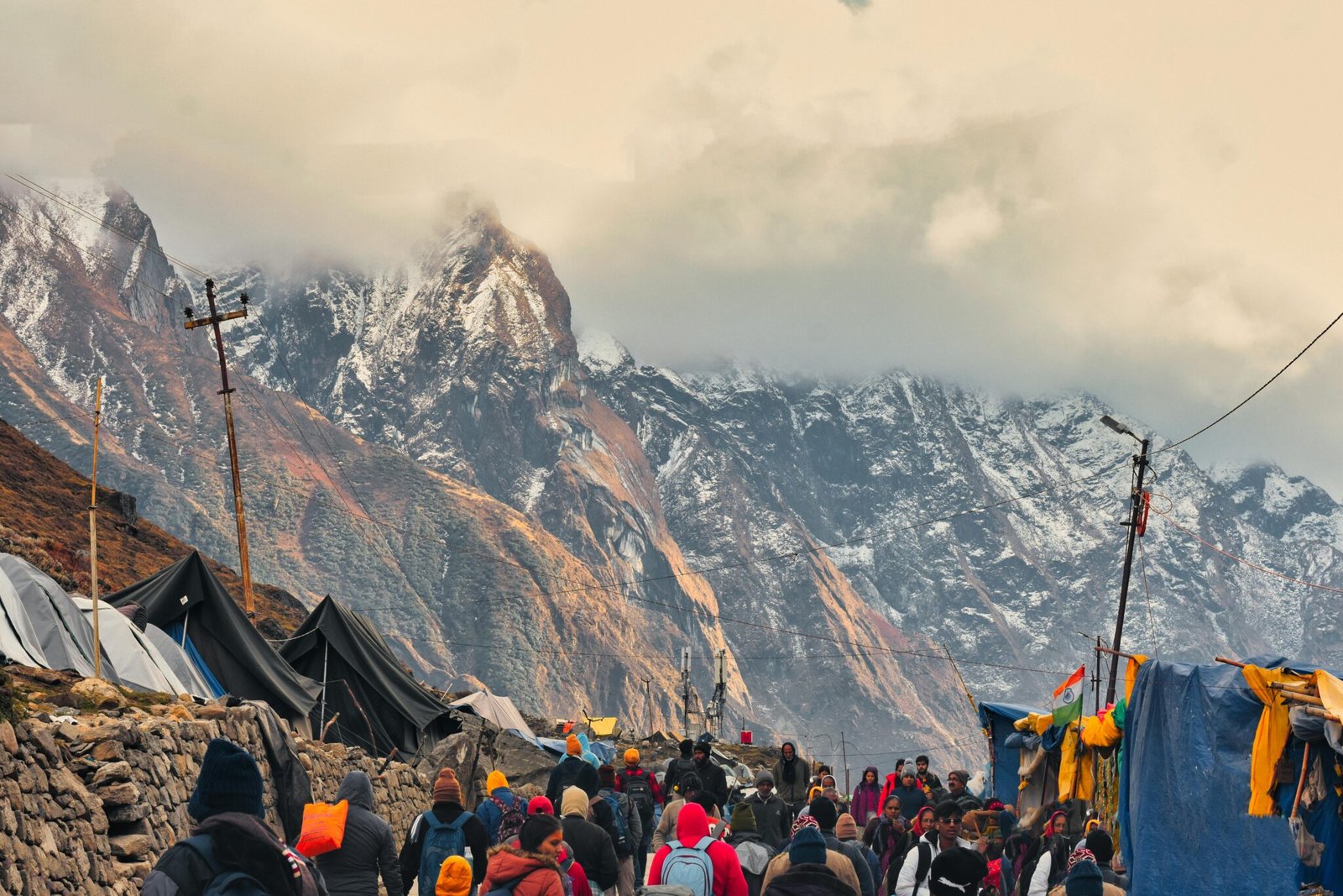 Explore the lively streets of Kedarnath with stunning Himalayan backdrop, capturing the essence of local life.